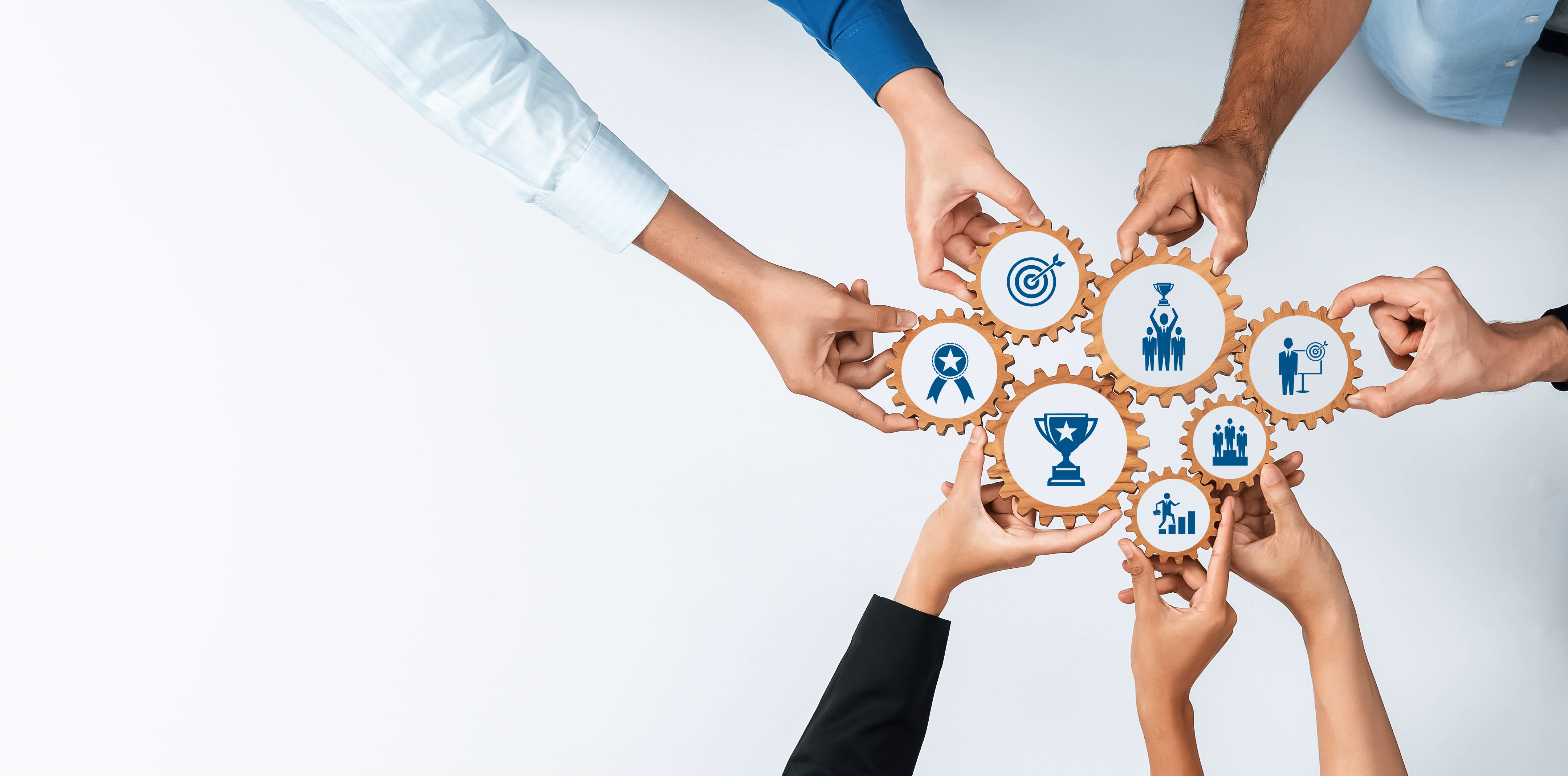 Collaboration and Teamwork Concepts with Hands Interacting Over Gear Icons for Business Strategy and Achievement Goals. Amity